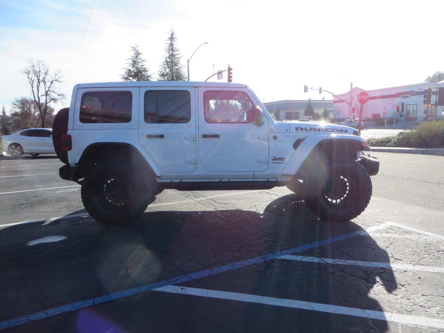2020 White /TAN Jeep Wrangler Unlimited Rubicon (1C4HJXFG8LW) with an 3.6L V6 DOHC 24V FFV engine, 6A transmission, located at 2630 Grass Valley Highway, Auburn, CA, 95603, (530) 508-5100, 38.937893, -121.095482 - 3" Zone offroad suspension system, Fox adventure series shocks, rocksliders, Teraflex HD tire relocation, Mopar HD tailgate hinge, 17" KMC wheels, and 37" BFG KO2 tires. - Photo#3